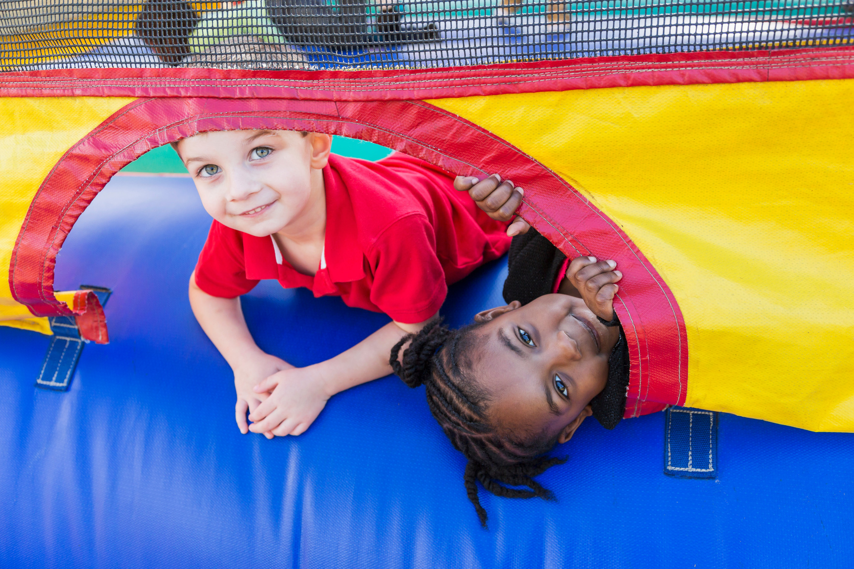 Two children playing in bounce house